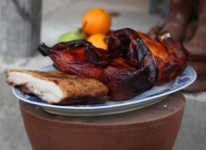 Before each lighting of the kiln, a sacred Taoist prayer ceremony is held.  This is an offering of roasted duck and pork and fresh fruit.