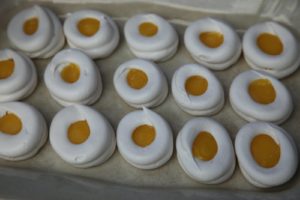 Meringue eggs filled with orange curd