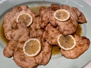 I served the pasta with this chicken piccata. The chicken was dredged in flour, sauteed in olive oil and butter, and then served in a sauce of white wine, lemon juice, and zest.