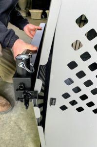 The Impact Dog Crate comes with a portable grooming rail and arm. Here, Fred replaces one side bracket with this grooming rail - also with easy-to-tighten butterfly latches.