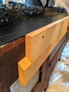 And when it is on the wall, it will be placed on top of another piece of wood also cut at an angle. this shows how they will fit together.