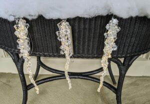 These three vividly lit icicle ornaments look wintry and elegant. Display them all around the home. Each set includes three illuminated icicle ornaments in graduated lengths.