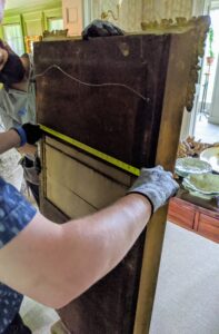 Here's another mirror getting measured for hanging. This full-length mirror will go into my foyer for guests that want to take a quick last look when they arrive.