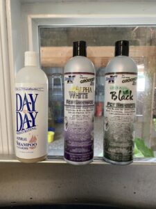 For dogs with sensitive skin or if one happens to get dirty and is not getting shown within a few days, I like to use the “Day to Day Oatmeal” shampoo. I like the smell and the gentleness of this shampoo. Before shows, I use either the “Alpha White” or the “Emerald Black” depending on the color of the dog. I think both of these shampoos bring out the dog’s best color.