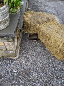 Chhiring uses two bales to ensure the water goes directly into the drain.