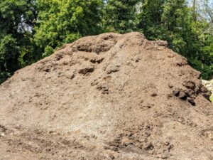 Here's a pile of mulch - a layer of material aged and ready to apply to the surface of the soil. Mulch is used for the conservation of soil moisture, improving fertility and health of the soil, reducing weed growth, and enhancing the visual appeal of a bed. I am so pleased we can use our organic debris in so many different ways.