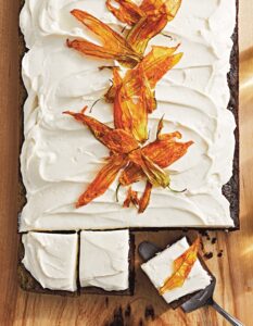 This book is divided by type with this Chocolate Zucchini Cake in our sheet cake chapter. It's a deliciously moist cake you can bake ahead. To make it even more special - use candied zucchini blossoms to decorate the top. (Photo by Lennart Weibull)