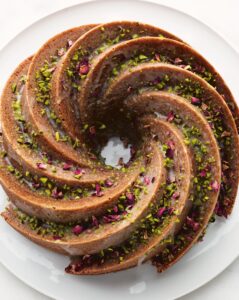 This Pistachio Cardamom Bundt Cake can be made any day of the week - fragrant and flavorful, this bundt cake is decorated with Sicilian pistachios and dried rose petals. And in my book, I provide the easiest solution for getting a bundt pan out in one piece. (Photo by Lennart Weibull)