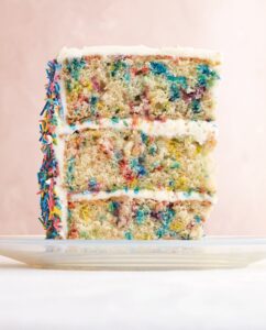 Our Sprinkle Cake is a big favorite in our Celebration Cakes section. No birthday party should be without one - complete with three cake layers and homemade "confetti" sprinkled inside and out. (Photo by Lennart Weibull)