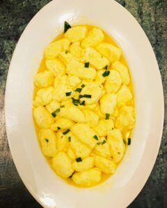 I made this ricotta gnocchi. The recipe is from San Francisco's Zuni Cafe. It's made using ricotta, sage, parmesan cheese, eggs, and salt. It is so light, and delicious. It was served with more butter and sage.