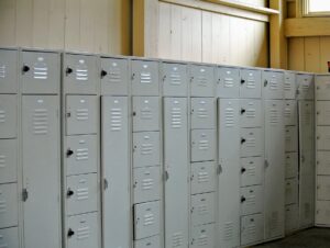 On the opposite side is this bank of lockers for the crew. Everyone has their own set of lockers, where they can store extra shoes, clothing, and other personal items.