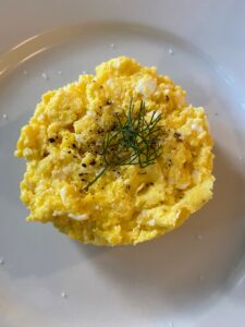 All the eggs we eat at Skylands are brought up from my farm in Bedford. There's nothing like farm fresh eggs for breakfast. These are simply made using butter, salt and pepper with a garnish of dill and parsley.