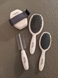 I have several good grooming tools available on my shop on Amazon, including my massage brush, my multipurpose brush in two sizes, and my 2-IN-1 detangling comb. I love using the dual sided comb for the cats because it is so light and easy to use, gets out tangles and dander, and makes grooming so quick. It's great for cats and dogs.