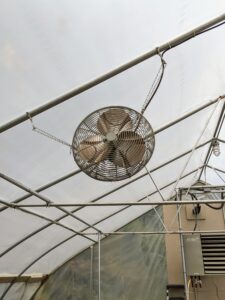 This house has three fans positioned up high. They're used mostly for circulating the air around the space.