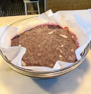 Cover the top with parchment paper and place the fruit into the refrigerator for a night or two.