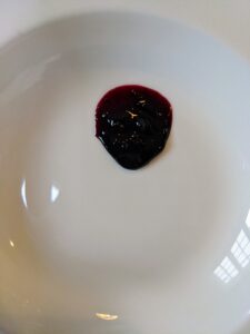 I poured a spoonful onto a plate - what a nice gel. It's the perfect thickness. Look at the beautiful, rich color of this blueberry jam.