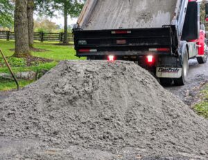 Next, a dump truck full of sand is brought in from Lawton Adams in nearby Somers, New York.