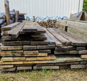 Some of these boards can be used in my hoop houses atop tree stumps as shelving for potted plants.