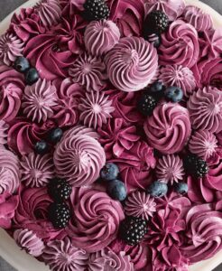 It’s hard to resist our Berry Layer Cake – look at all the gorgeous deep colors of the blueberries, black raspberries, blackberries, and varying shades of burgundy frosting. This recipe packs fresh fruits in the dough and sweet black raspberry jam into the meringue buttercream. (Photo by Mike Krautter)
