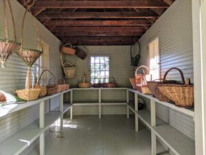 Slowly, the baskets are returned to the house. Many of these baskets can actually be hung from the rafters - to save shelf space for baskets without handles.