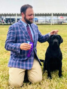 Recently, Tim was in Virginia showing Kima trying to get her AKC Championship points. In this photo, Kima had just won "Winners Bitch" and "Best of Winners." "Best of Winners" is awarded to either the "Winners Dog" or "Winners Bitch." It denotes the best dog out of all the regular class entries (non-champions). Doesn’t Kima look beautiful here? It is nice to have great handlers that you trust with your animals. Tim and Megan always do a great job with my dogs. Thanks, guys.