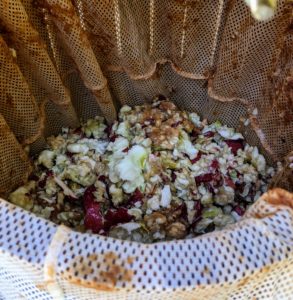 It takes quite a few apples to fill the tub. Once the tub is filled with apple pulp - skins, seeds and cores - the pressing process can begin.