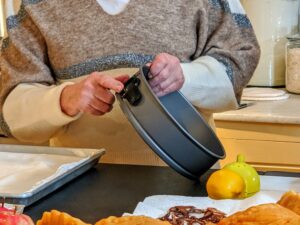 For the Five-Spice Pumpkin Pie with Phyllo Crust, I start with a springform cake pan. Here i am pointing out the spring feature, which allows one to remove the pan from the pie without damaging the phyllo crust.