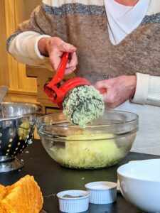 I like to put all the potatoes through a ricer. A potato ricer is a kitchen implement used to process potatoes or other food by forcing it through a sheet of small holes, which are typically about the diameter of a grain of rice.