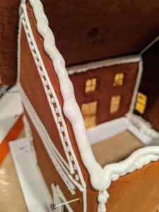 Then more icing is applied to support the roof.