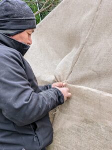 Phurba has done this burlap process for several years. Each season, the crew streamlines the process making it more efficient.