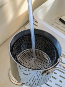 Just fill the pot to the bottom of the steamer basket - about an inch-and-a-half.
