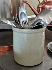 I keep a crock near my stove filled with tasting spoons - large spoons intended to lift out about a 1/2 tablespoon of liquid from a pan or pot for sampling. I also keep some tasting forks close at hand.
