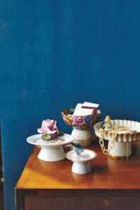 I have long used cake stands to display much more than sweet treats, but if you don't have any, create your own by upturning flea market finds such as dishes and saucers atop upside down bowls for bases - it's a "Good Thing."