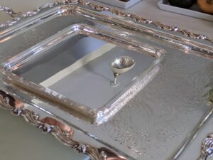 This square serving tray is buffed to perfection - the round object in the tray is the reflection of the light fixture.