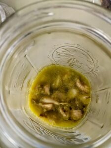 To store, squeeze out the cloves into a jar and add enough olive oil to cover. I put them all in a glass Ball jar.