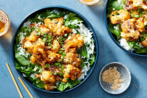 For those who prefer plant-based meals, this is Korean BBQ Cauliflower with Steamed Rice. The trick is roasting the cauliflower before coating it in a sweet and spicy gochujang sauce. We add baby spinach to the rice before serving for an extra hit of veggies and a sprinkle of sesame seeds on top for a nutty crunch.