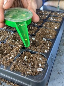 These seeds are much smaller, so Ryan uses a hand seed sower - also from Johnny's. This tool allows one to control the flow of seeds through five different size outlets. The funnel-shaped spout makes it easy to return unused seeds to packet.