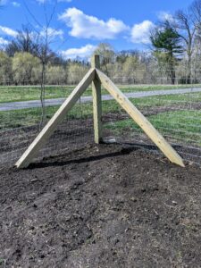 This triangular bracing configuration is formed by one corner vertical post and two bracing pieces.