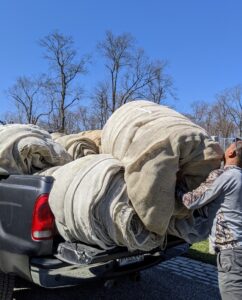 All the rolls of fabric are loaded onto the pick-up and taken to the stable barn where they can be kept dry. One of the few downsides to this fabric is that it will start to fray and disintegrate after some time, especially if exposed to moisture.