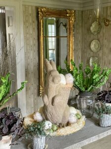 In my foyer is this big rabbit - the same one I made for the April 2015 issue of Martha Stewart "Living." Smaller bird's nest ferns share the faux bois table.