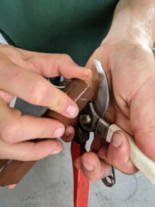 Brian holds the whetstone at an angle to sharpen the edges and maintain the bevel. The bevel is what makes a tool sharp, and blades are factory ground to a precise angle that’s just right for each tool.