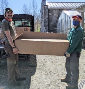 It's always exciting when trees arrive at the farm. Since I plant so many trees, I get most of them in the form of bare-root cuttings. Brian and Chhiring load one of two big boxes onto our trusted Polaris Ranger.