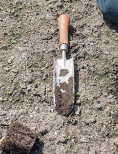 Brian uses a narrow trowel. it is made of stainless steel, with a five-inch by three-inch blade and a five-inch handle.