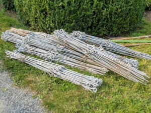 Instead of hoop style peony supports, I use these metal stakes that I designed myself for use at the farm. Each metal support has two eyes, one at the top and one in the middle.