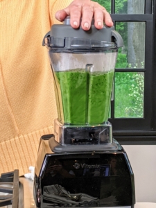 The soup mixture is pureed in a blender - look at that gorgeous green color.
