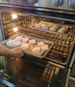 Back in my outdoor kitchen, Pierre places the meringue in the oven. It takes quite some time to bake at 180-degrees Fahrenheit, so he does this earlier in the day. Pavlova is a meringue-based dessert named after the Russian ballerina Anna Pavlova. It has a crisp crust and is soft and light inside, and topped with fruit and whipped cream.