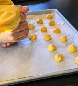 In the afternoon, Chef Pierre made gougères. A gougere in French cuisine is a baked savory choux pastry made of choux dough and mixed with cheese. The cheese is commonly grated Gruyère, Comté, or Emmentaler. These are always a big hit to serve before the main meal.