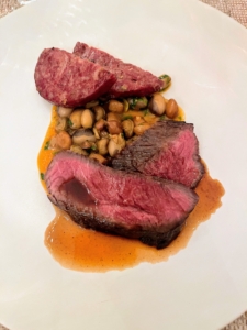 The course included tender Stone Barns Grass Fed beef with shelling beans and tomatoes.