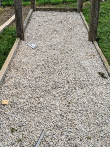 The floor of the coop is then framed and filled with gravel.