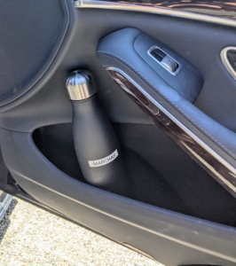 On the passenger side door, I like to keep my bottle of water. These side door compartments are very roomy and can accommodate my large reusable water container.
